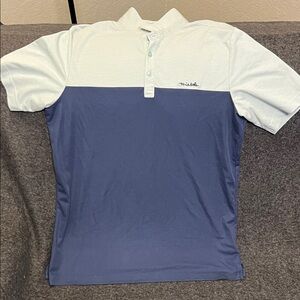TravisMathew men's colorblock performance polo shirt in white and blue